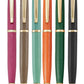 The Graphic Image Leather Wrapped Pen Collection features six ballpoint pens with gold accents and textured grips in pink, brown, teal, orange, green, and black—an ideal gift for anyone who loves a sleek leather-wrapped pen.