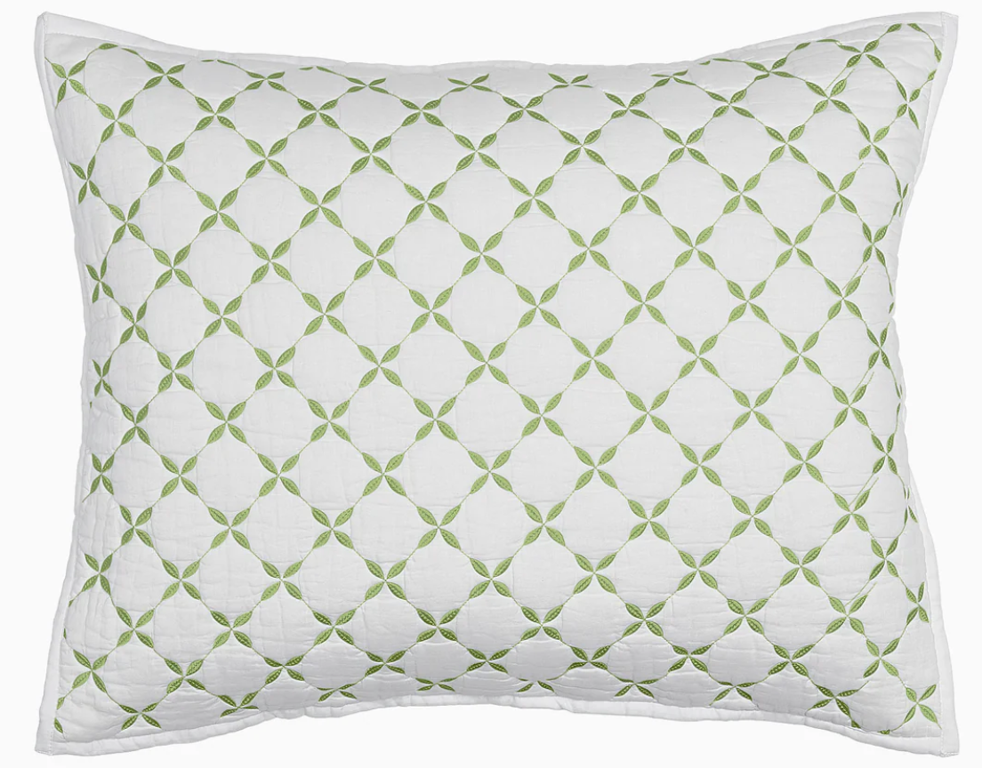 The Layla Bedding Collection by John Robshaw features a white rectangular pillow adorned with a green geometric pattern of interlocking circles and delicate leaf-like shapes inspired by Mughal gardens, bordered with crisp white piping—a perfect complement to your bedding or cotton voile quilt.