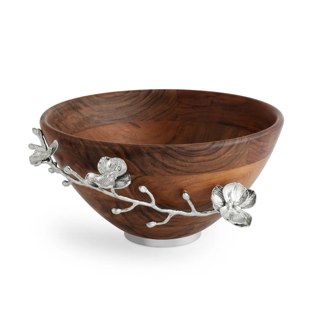 A round wooden bowl with a silver metal base, featuring decorative silver branches and enamel blooms on the side, the Michael Aram White Orchid Wood Salad Bowl adds a touch of sophistication to any table setting.