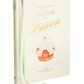 Abrams’ "The Little Book of Ladurée: Patisserie" is a hardcover book featuring pastry illustrations, a green ribbon bookmark, and recipes for classic Parisian desserts.