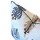 Introducing the Gobi Blue Down Pillow by Hive Custom Pillows—a 22x22 white pillow with blue piping, adorned with an embroidered pattern of blue and brown stylized trees. Handcrafted for both comfort and style, this pillow is a stunning addition to your home décor.