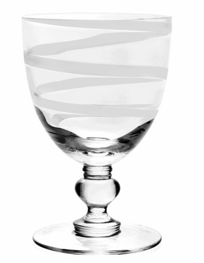 The Bella Bianca Collection by William Yeoward Crystal features clear glass goblets with round bases, decorative stems, and elegant white spiral stripes. California residents: this product may include a Proposition 65 warning.