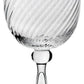The Venetia Drinkware Collection by William Yeoward Crystal features clear goblets with decorative spiral patterns and elegant stems, inspired by Venetian glassmakers, displayed against a plain white background.