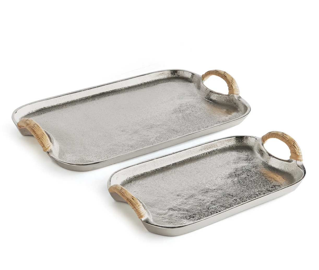 Two rectangular trays from the Helena Decorative Tray Collection by Napa Home & Garden feature textured cast aluminum surfaces and rattan-wrapped handles, displayed on a white background.