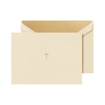 The Crane Gold Cross Note Card Set features cream note cards with a small gold cross on the front, partially inserted into matching cream cotton paper envelopes.