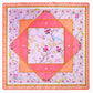 The Mahjong Mat Collection by Oh My Mahjong is a square, multi-layered mat with floral and geometric patterns in pink, orange, and gold, featuring measurement markings on the edges and a non-slip surface for stability.
