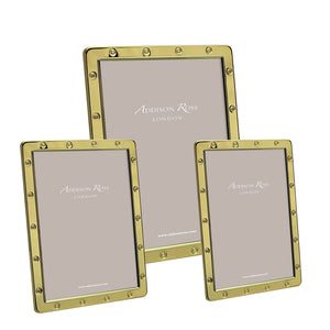 The Gold Locket Frame Collection by Addison Ross includes three gold-plated frames with studded edges and velvet backstands. Each comes beautifully gift boxed, making them perfect for any occasion. Placeholder text reads "Addison Ross London.