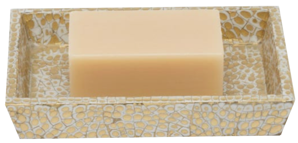 A rectangular beige soap bar rests in a textured gold and white dish from the elegant Callas Bath Collection by Pigeon & Poodle.