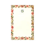 The Gracie Notepad by Rifle Paper Co. features a rectangular design with a scalloped floral border and a small blue flower motif at the top center on a clean white background, making it perfect as an illustrated notepad or a charming to-do list.