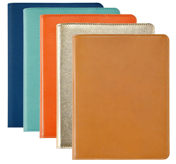 Four Graphic Image Leather Notebooks, each 9" and available in navy, teal, orange, and gold leather with premium gold-gilded pages, are aligned vertically—perfect writer's companions.