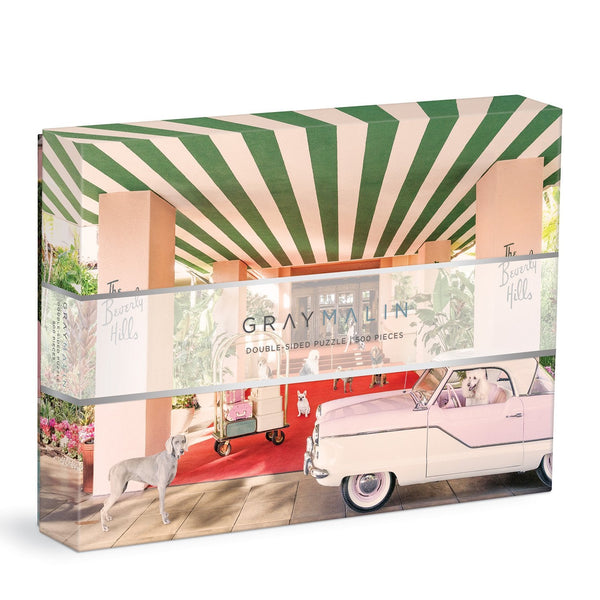 The Gray Malin 500-piece puzzle by Chronicle Books showcases fine art photography of a vintage car and a dog under a green and white canopy. Inspired by "The Dogs at the Beverly Hills Hotel," it adds luxurious charm to your puzzling experience with its double-sided masterpiece.