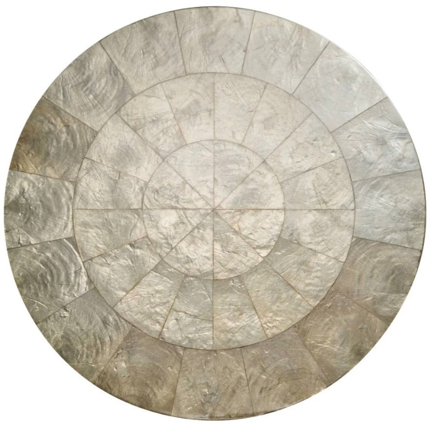 The Kim Seybert Capiz Placemat features a segmented, mosaic-style design in metallic silver and gray rings—an elegant round accent ideal as a striking table backdrop or stylish placemat for your dining setting.
