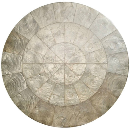 The Kim Seybert Capiz Placemat features a segmented, mosaic-style design in metallic silver and gray rings—an elegant round accent ideal as a striking table backdrop or stylish placemat for your dining setting.