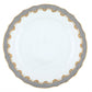 Herend Fish Scale Gray Collection plate, featuring a white ceramic base with a grey and gold patterned rim and scalloped edges, evoking fine porcelain craftsmanship, photographed from above on a white background.