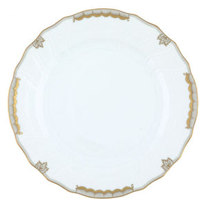 The Herend Princess Victoria Gray Collection features a white porcelain plate with a scalloped edge, elegant gold trim, and delicate gold leaf accents around the rim, capturing timeless Herend sophistication.