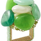 The Kim Seybert Sea Stone Napkin Ring features polished green beach stones stacked on a gold wire and a beaded rectangular frame for a decorative touch.
