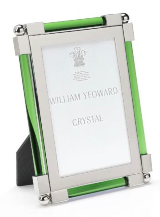The Moss Green Classic Frame Collection by William Yeoward Crystal features a rectangular silver and green photo frame with a bright finish and stand—an elegant choice for displaying cherished photos.