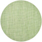 The Kim Seybert Portofino Placemat features a light green woven vinyl texture, viewed from above on a white background. Stylish and easy to clean, it brings a fresh touch to any table setting.