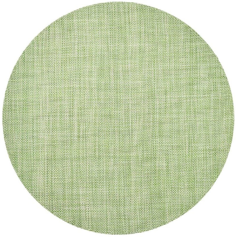 The Kim Seybert Portofino Placemat features a light green woven vinyl texture, viewed from above on a white background. Stylish and easy to clean, it brings a fresh touch to any table setting.