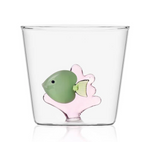 From the Marine Garden Drinkware Collection by Ichendorf Milano, this clear glass tumbler features a decorative handmade green fish and pink coral design embedded in the base.