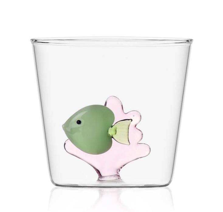From the Marine Garden Drinkware Collection by Ichendorf Milano, this clear glass tumbler features a decorative handmade green fish and pink coral design embedded in the base.