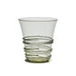 Part of Juliska’s Ella Drinkware Collection, this clear glass tumbler features a flared rim and decorative spiral ridges wrapping around the lower half, showcasing the brand’s signature mouth-blown glassware craftsmanship.