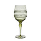 Raise a toast with this green-tinted wine glass from Juliska’s Ella Drinkware Collection, featuring a twisted, raised spiral wrapping around the bowl and elegantly perched atop a slender stem with a round base—artisan-crafted glassware inspired by classic Juliska mouth-blown designs.