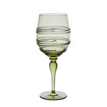 Raise a toast with this green-tinted wine glass from Juliska’s Ella Drinkware Collection, featuring a twisted, raised spiral wrapping around the bowl and elegantly perched atop a slender stem with a round base—artisan-crafted glassware inspired by classic Juliska mouth-blown designs.