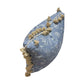 The Greta Alta Pillow by Hive Custom Pillows features blue fabric with white floral patterns and beige tassels along the edges. Shown on its side against a white background, this pillow is 100% down-filled for superior comfort.