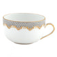 A white teacup from the Herend Fish Scale Gray Collection by Herend, featuring a delicate pattern of gray scales and gold accents along the rim and handle, reminiscent of Queen Victoria's refined taste in porcelain.