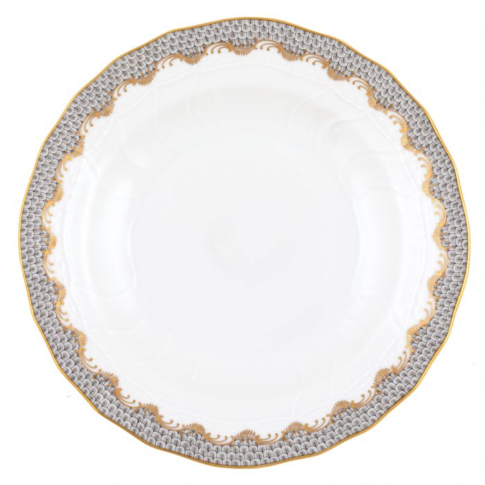 A white ceramic plate from the Herend Fish Scale Gray Collection, featuring a scalloped gold and silver patterned edge, showcases artistic appreciation reminiscent of classic Herend porcelain.