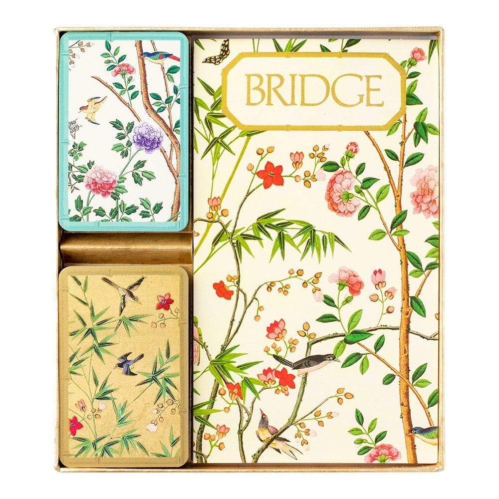 The Caspari Chinese Wallpaper Bridge Collection boxed set includes two decks of playing cards and a score pad, all featuring floral and bird designs—ideal for your next group or social card game night.