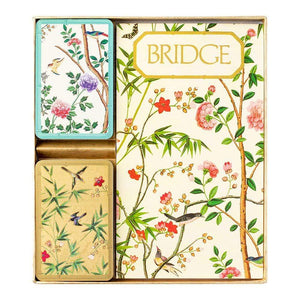 The Caspari Chinese Wallpaper Bridge Collection boxed set includes two decks of playing cards and a score pad, all featuring floral and bird designs—ideal for your next group or social card game night.