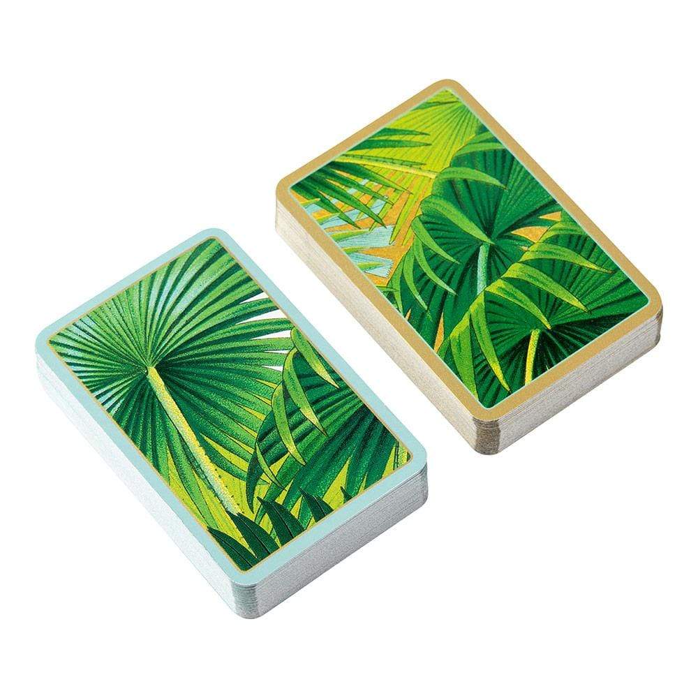 The Caspari Palm Fronds Bridge Gift Set features two rectangular decks with green tropical palm leaf covers—one accented in gold and the other in light blue—a stylish gift set for any game lover.