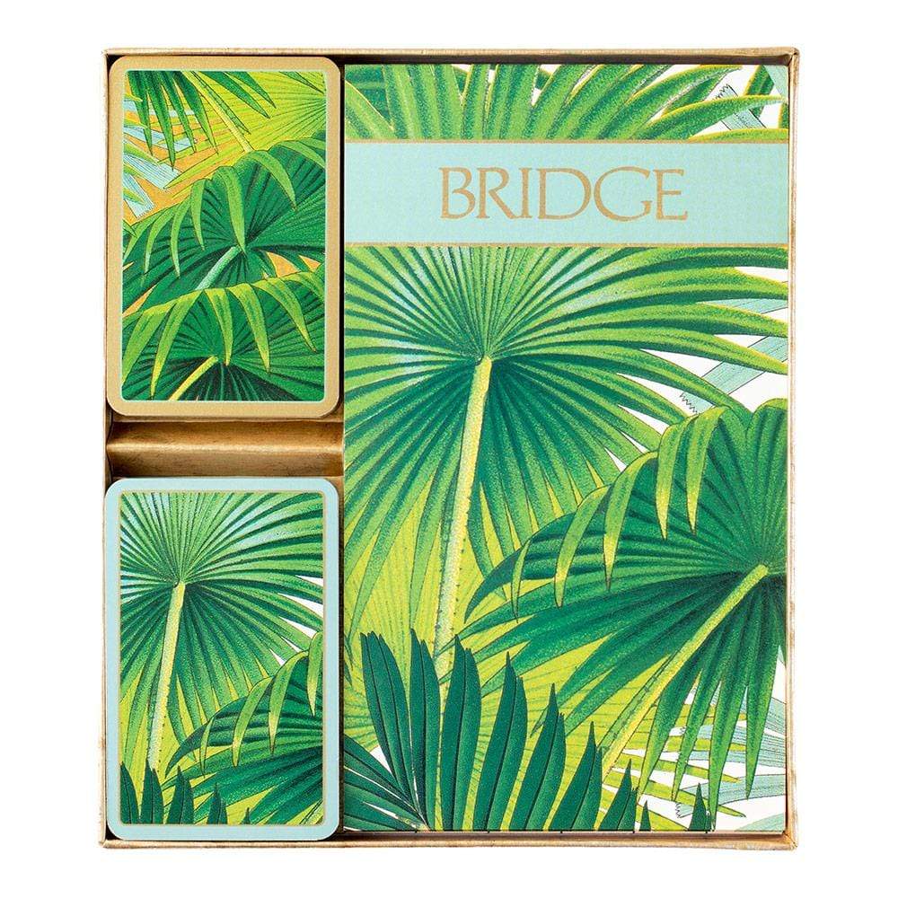 The Caspari Palm Fronds Bridge Gift Set features playing cards with a green palm leaf design and matching packaging—ideal for bridge games or as a stylish collectible.
