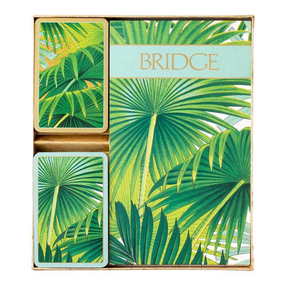 The Caspari Palm Fronds Bridge Gift Set features playing cards with a green palm leaf design and matching packaging—ideal for bridge games or as a stylish collectible.