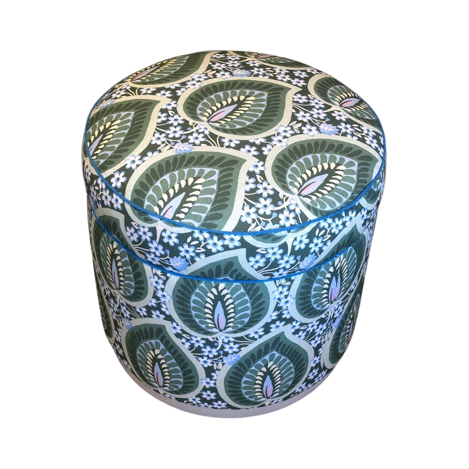 The Grant Swivel Ottoman by Highland House features fabric upholstery with a green and white leaf pattern in a botanical design, plus 360-degree swivel functionality for versatile use.