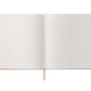 The Wildwood Embroidered Guest Book by Riffle Paper Co. features blank left pages, lined right pages, and a white ribbon bookmark at the center.
