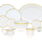The Herend Gwendolyn White and Gold Collection features porcelain dishes, bowls, cups, and a creamer with scalloped edges and 24k gold trim, beautifully arranged on a white background.