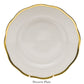The Herend Gwendolyn White and Gold Collection dessert plate features a scalloped edge and 24k gold trim, displayed upright on a stand—a perfect piece for artistic appreciation.