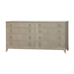 The Kindel Double Chest is a modern light wood dresser with ten drawers, each adorned with round metal pull handles. With its simple design and short legs, this stylish bedroom piece offers sleek storage.