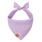 The Foggy Dog's Easter Eggs Reversible Bandana features a light purple fabric with white polka dots, a top tie, and a small brown tag—ideal for spring festivities or Easter egg hunts.