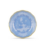 A round blue porcelain plate from the Ginori 1735 Oriente Italiano Pervinca Serveware & Decor Collection, adorned with white floral motifs and a yellow-bordered scalloped edge, displayed on a plain white background—an exquisite choice for those seeking elegant home decor accents or distinctive porcelain dinner plates.