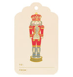 Crane’s Nutcracker Gift Tag Set features red and gold nutcracker soldier designs with “TO:” and “FROM:” spaces at the bottom for easy gifting.