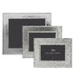 Three Michael Aram Hammertone Frames in varying rectangular sizes are stacked, each featuring a unique hammertone metal texture and distinctive black inserts branded with “Michael Aram.”.