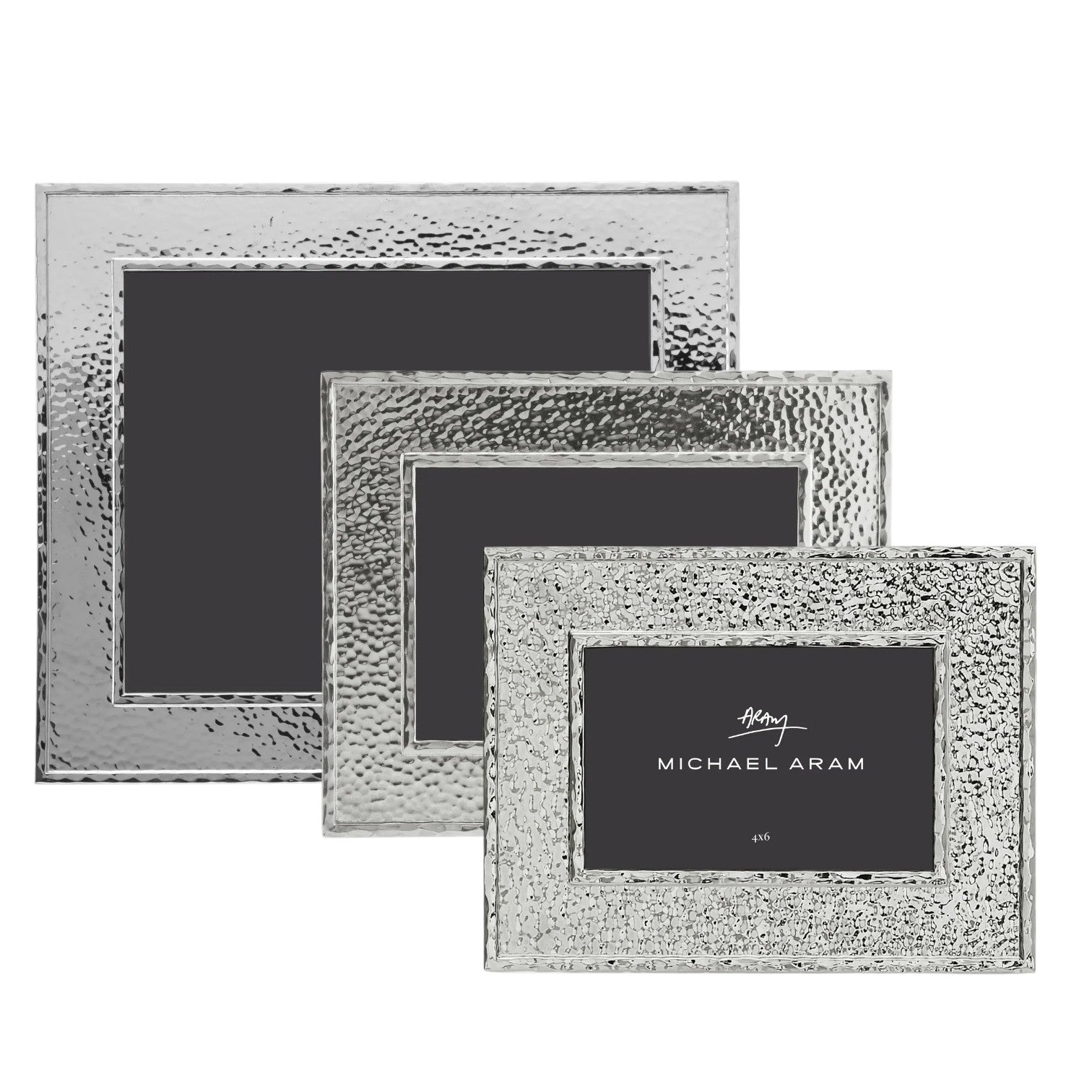 Three Michael Aram Hammertone Frames in varying rectangular sizes are stacked, each featuring a unique hammertone metal texture and distinctive black inserts branded with “Michael Aram.”.