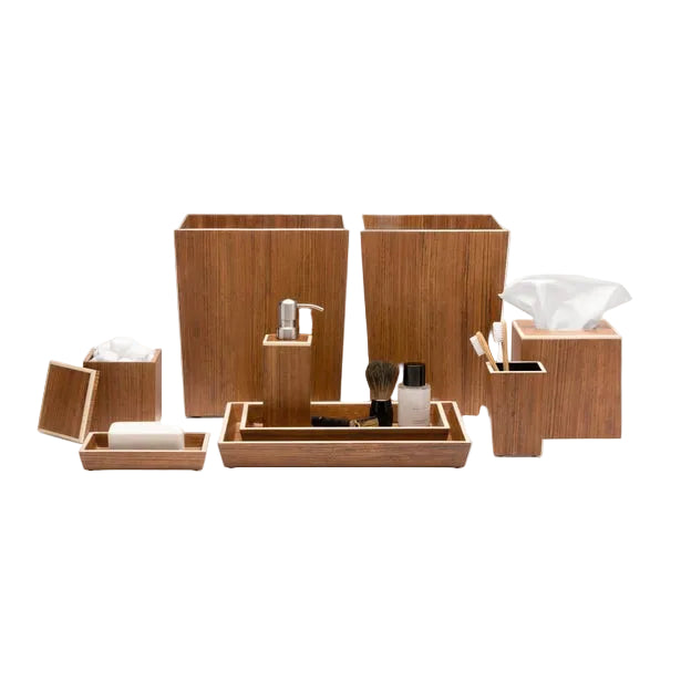 The Harper Dark Teak bathroom accessory set by Pigeon & Poodle features elegant bamboo-inspired pieces—tissue boxes, wastebaskets, trays, a soap dispenser, and small containers—arranged on a white background.