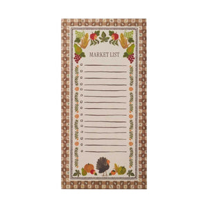 Promote the Harvest Gingham Market Pad by Rifle Paper Co., which features a charming border of autumn vegetables and leaves, a festive turkey illustration at the bottom, and brown gingham-patterned edges. The center provides lined space with checkboxes to organize your Thanksgiving grocery list, while a convenient fridge magnet on the back keeps your notes within easy reach.
