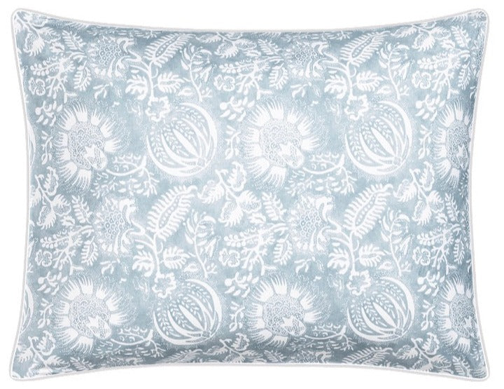 The Matouk Granada Bedding Collection in Hazy Blue features a rectangular pillow with a light blue and white floral design, crafted from OEKO-TEX certified Egyptian cotton percale for softness and breathability.