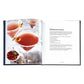 The Williams Sonoma: Cocktails book by Graphic Image displays mixology tips and a recipe for Pomegranate Martini, shown with a photo of two sugar-rimmed martinis garnished with orange twists—ideal inspiration for your home bar.